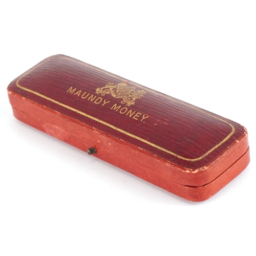 1085 - A George V 1933 silver Maundy set housed in a red presentation box.