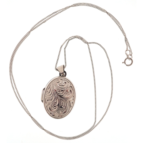 3111 - A 9ct white gold engraved locket on a 9ct white gold necklace, 2cm high and 46cm in length, 3.4g.