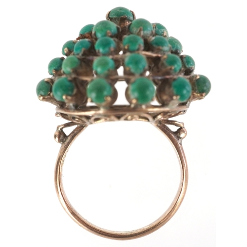 3305 - A 14K gold green stone five tier cluster ring, size H, 5.0g.
