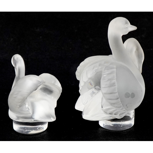 8 - Lalique, two frosted glass studies of swans, etched Lalique France to the bases, the largest 7.5cm h... 