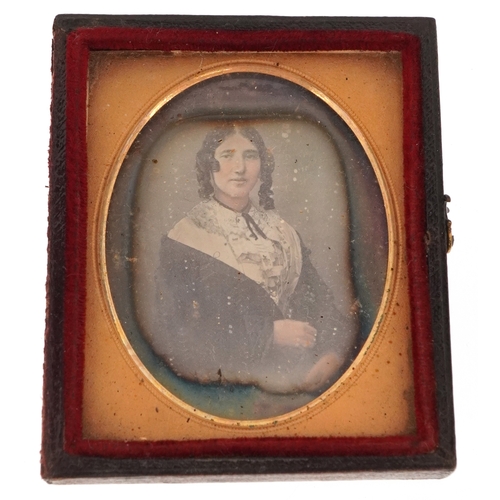 309 - A 19th century daguerreotype of a young female, housed in a velvet lined case, 7cm x 6cm.