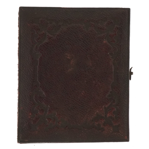 309 - A 19th century daguerreotype of a young female, housed in a velvet lined case, 7cm x 6cm.