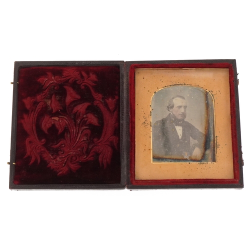 308 - A 19th century daguerreotype of a gentleman in formal dress, housed in a velvet lined case, 9cm x 8c... 