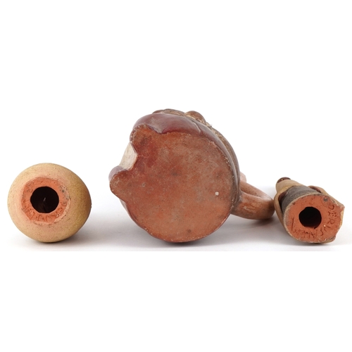 1832 - Two Middle Eastern pottery figures inscribed Jerusalem to the bases together with a stirrup spout ve... 