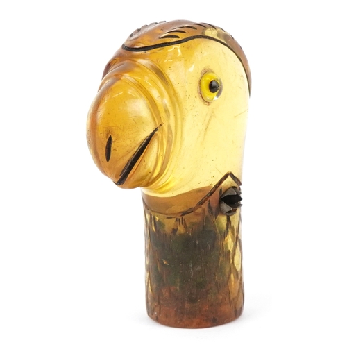 1771 - An early 20th century celluloid parasol handle in the form of a parrot, 6.9cm high.