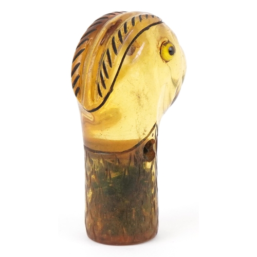 1771 - An early 20th century celluloid parasol handle in the form of a parrot, 6.9cm high.