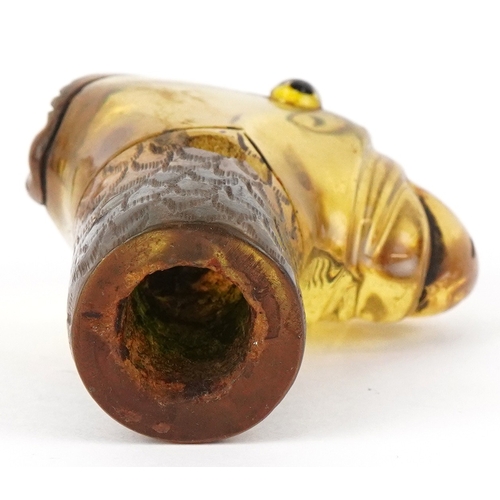 1771 - An early 20th century celluloid parasol handle in the form of a parrot, 6.9cm high.