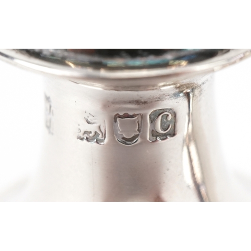 3662 - Goldsmiths & Silversmiths Co., a pair of Victorian silver demi fluted casters housed in a velvet and... 