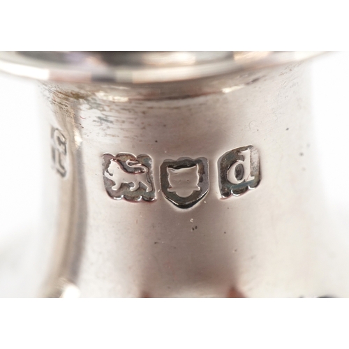 3662 - Goldsmiths & Silversmiths Co., a pair of Victorian silver demi fluted casters housed in a velvet and... 