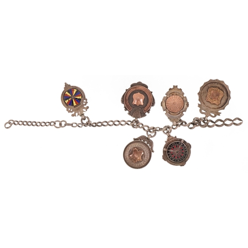 1353 - Six antique silver sports jewels including two enamelled dart boards, mounted on a silver chain, tot... 