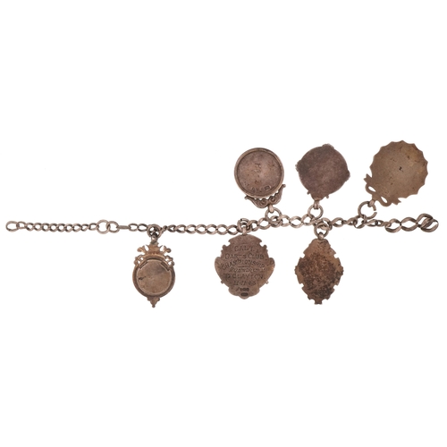 1353 - Six antique silver sports jewels including two enamelled dart boards, mounted on a silver chain, tot... 