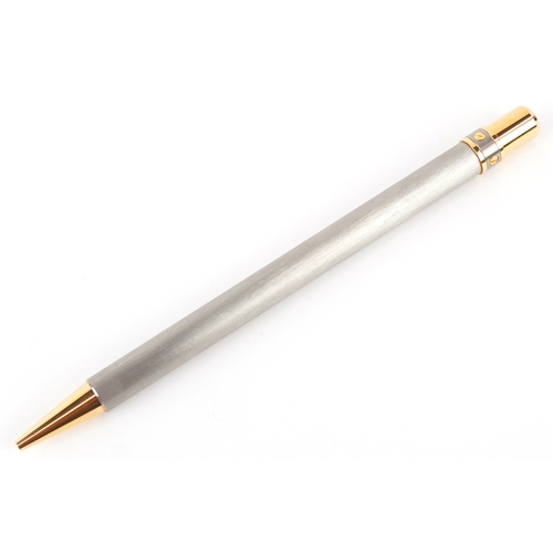 54 - Cartier, a stainless steel and gold plated Must de Cartier ballpoint pen numbered B95471, with box a... 