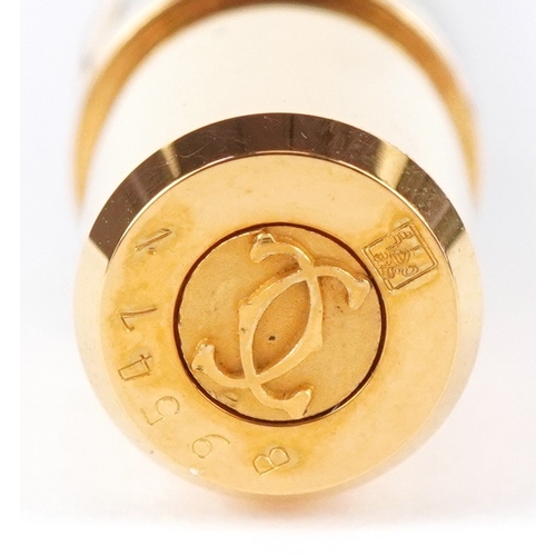 54 - Cartier, a stainless steel and gold plated Must de Cartier ballpoint pen numbered B95471, with box a... 