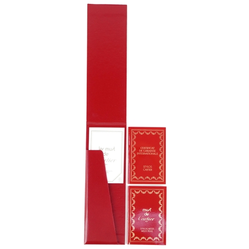 54 - Cartier, a stainless steel and gold plated Must de Cartier ballpoint pen numbered B95471, with box a... 