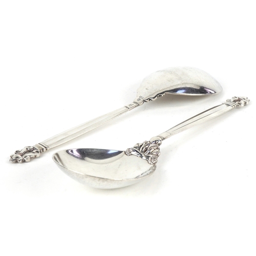 3731 - A pair of Georg Jensen Danish sterling silver serving spoons in the acorn pattern, London import mar... 