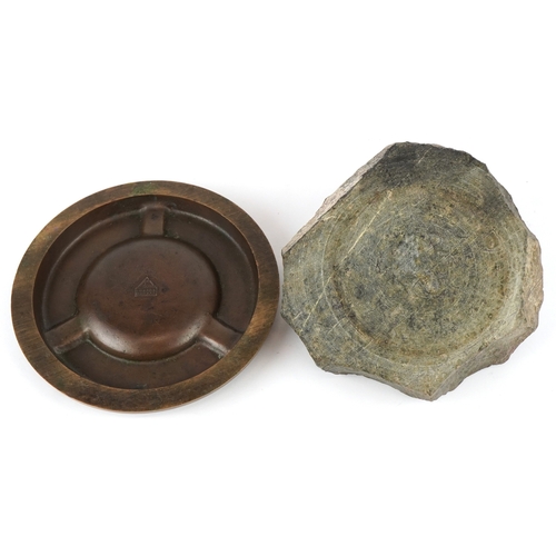 499 - Two ashtrays comprising a London Bronze ashtray embossed with animals and a Cornish serpentine ashtr... 