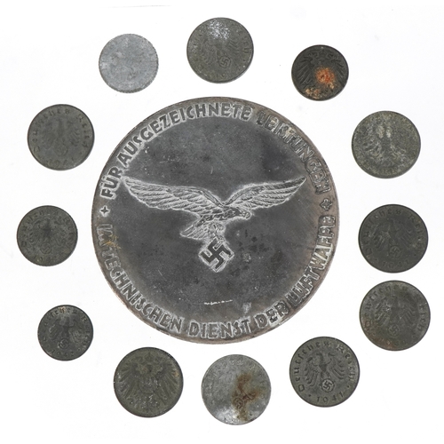 2742 - A German military interest World War II Hermann Göring medal with a selection of German coins, the m... 