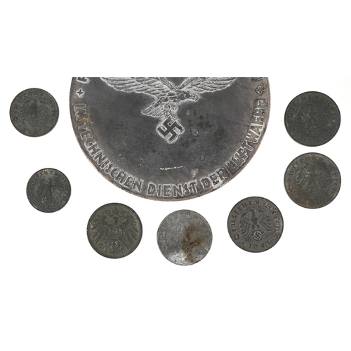 2742 - A German military interest World War II Hermann Göring medal with a selection of German coins, the m... 