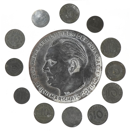 2742 - A German military interest World War II Hermann Göring medal with a selection of German coins, the m... 