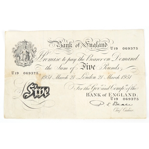 1195 - A Bank of England seated Britannia five pound note dated 21st March 1951, Chief Cashier P. S. Beale,... 