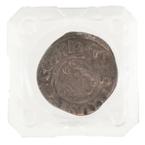 1122 - A King John 1199-1216 hammered silver penny encased in a plastic display slab, 18mm in diameter.