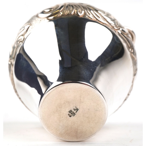 3721 - A Kappa Gallery Greek silver vase with embossed decoration, 10cm high, 159.0g.