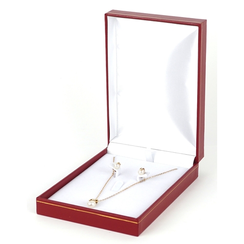 3086 - A 9ct gold cultured pearl pendant on a 9ct gold necklace together with matching earrings, 1.6cm high... 