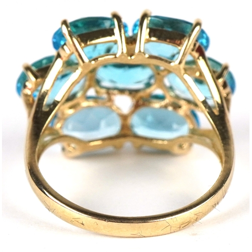 3186 - A 10K gold topaz cluster ring, size P, 5.7g.