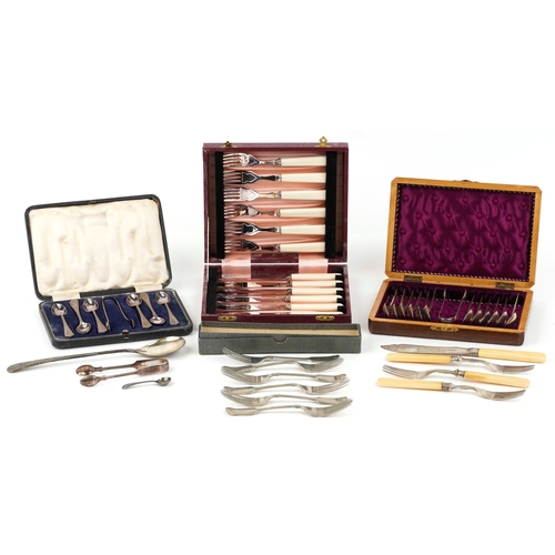 3754 - A collection of plated cutlery sets including teaspoons, sugar tongs and a knife and fork set togeth... 