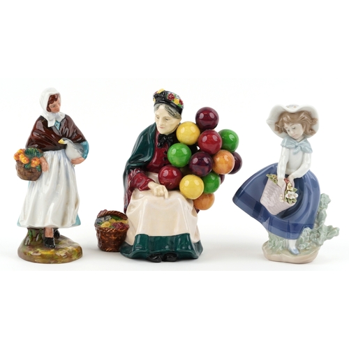 650 - A Royal Doulton The Old Balloon Seller HN 1315 together with a Royal Doulton Country Lass HN 1991 an... 