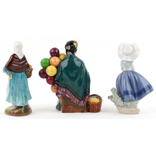 650 - A Royal Doulton The Old Balloon Seller HN 1315 together with a Royal Doulton Country Lass HN 1991 an... 