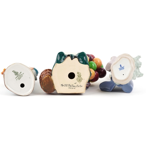 650 - A Royal Doulton The Old Balloon Seller HN 1315 together with a Royal Doulton Country Lass HN 1991 an... 