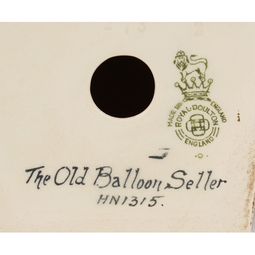 650 - A Royal Doulton The Old Balloon Seller HN 1315 together with a Royal Doulton Country Lass HN 1991 an... 