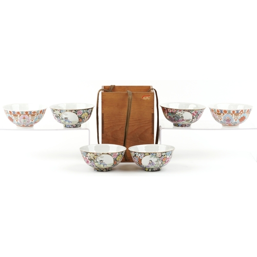 1765 - A set of four Chinese porcelain footed bowls hand painted in the famille noire palette with panels o... 