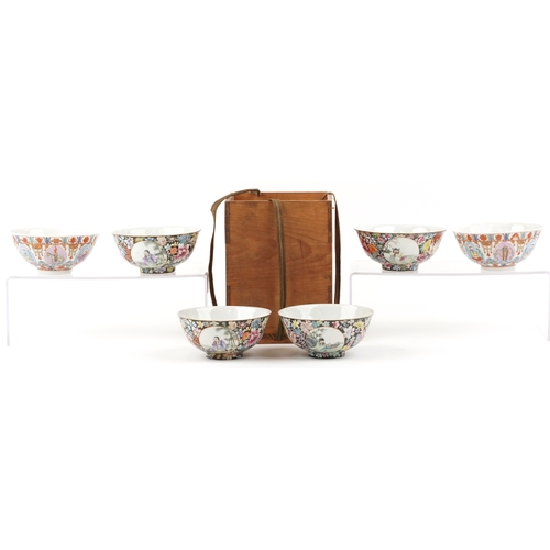 1765 - A set of four Chinese porcelain footed bowls hand painted in the famille noire palette with panels o... 