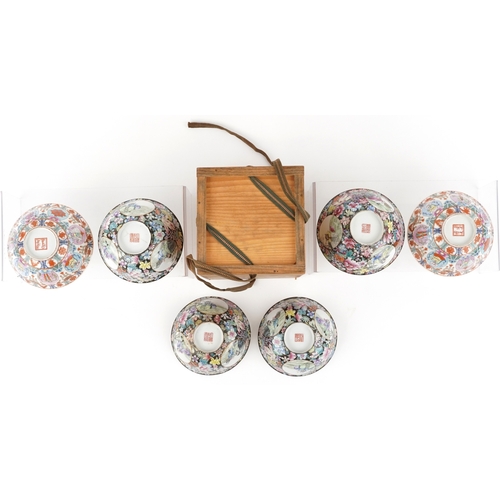 1765 - A set of four Chinese porcelain footed bowls hand painted in the famille noire palette with panels o... 