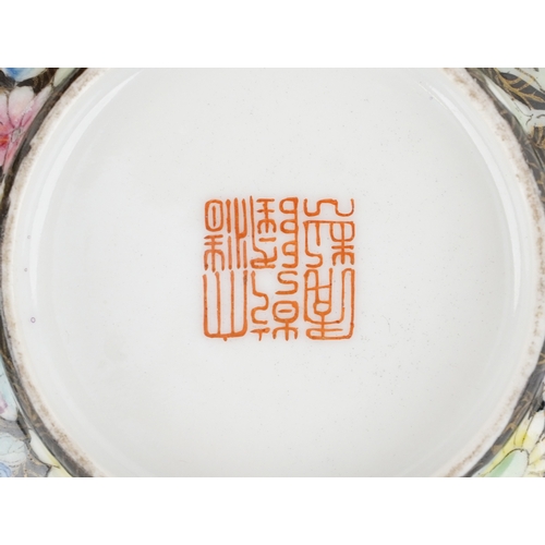 1765 - A set of four Chinese porcelain footed bowls hand painted in the famille noire palette with panels o... 