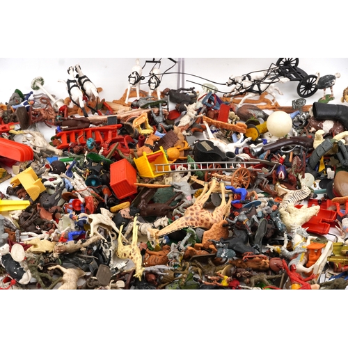 779 - A large collection of vintage toys including farmyard animals, cowboys & Indians and model soldiers.