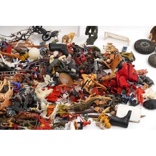 779 - A large collection of vintage toys including farmyard animals, cowboys & Indians and model soldiers.