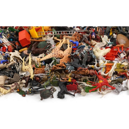 779 - A large collection of vintage toys including farmyard animals, cowboys & Indians and model soldiers.