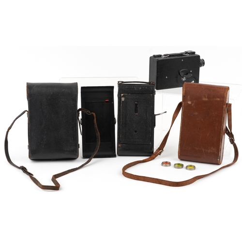 1061 - A Ciné-Kodak model BB Junior camera, cased, together with a folding camera within a brown leather ca... 