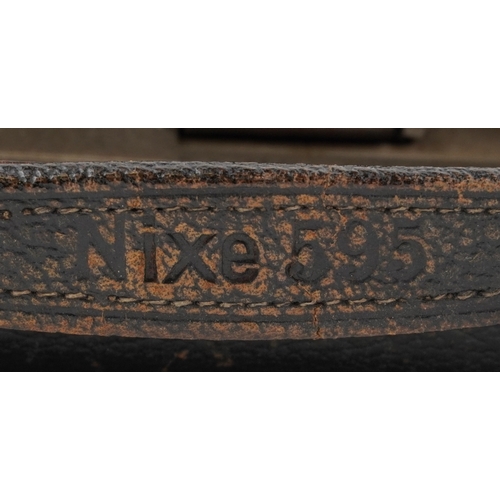 1061 - A Ciné-Kodak model BB Junior camera, cased, together with a folding camera within a brown leather ca... 