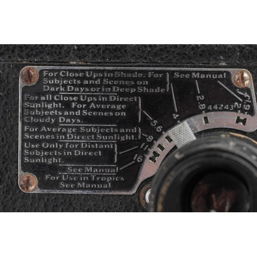 1061 - A Ciné-Kodak model BB Junior camera, cased, together with a folding camera within a brown leather ca... 