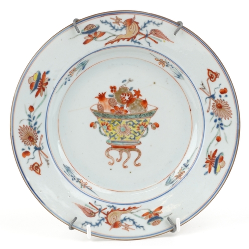 470 - A Chinese porcelain plate hand painted with flowers, 22cm in diameter.