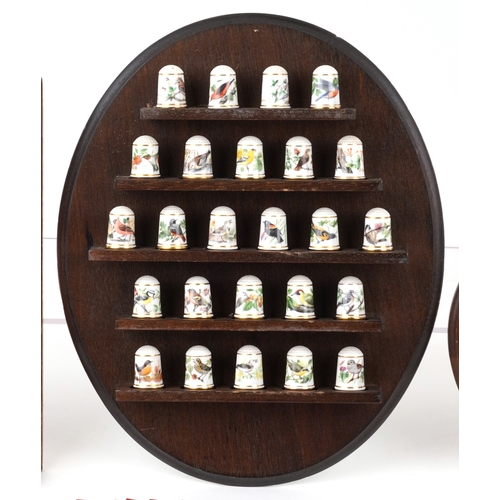 668 - Collectable porcelain thimbles with display stands including The Garden Birds Thimble Collection and... 