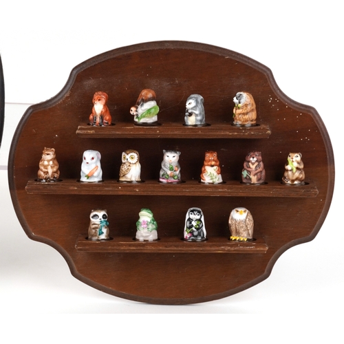 668 - Collectable porcelain thimbles with display stands including The Garden Birds Thimble Collection and... 