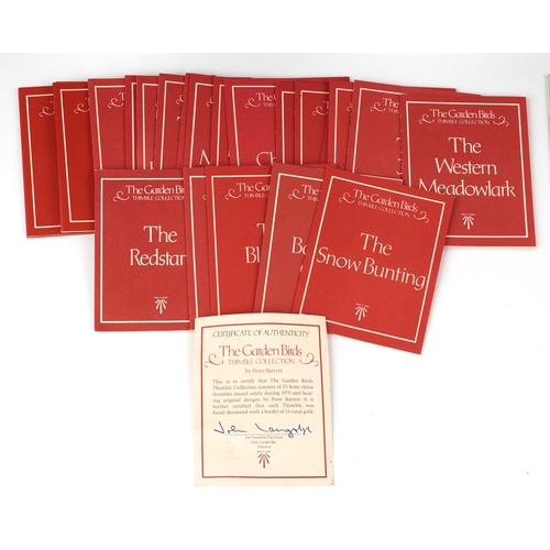 668 - Collectable porcelain thimbles with display stands including The Garden Birds Thimble Collection and... 