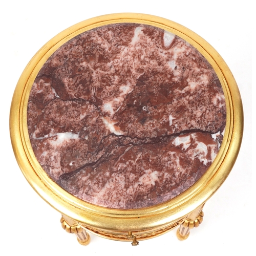 2137 - A modern gilt painted bedside chest of three drawers with a rouge marble top, raised on fluted legs ... 