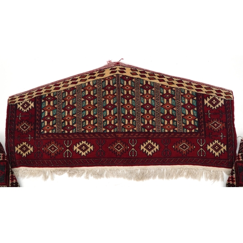 2202 - Three Turkmen door hangings, late 20th century, each with typical red field and stylized motifs, the... 