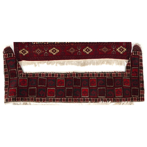 2202 - Three Turkmen door hangings, late 20th century, each with typical red field and stylized motifs, the... 